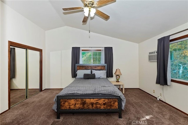 carpeted bedroom featuring multiple windows, vaulted ceiling, a wall mounted AC, and ceiling fan