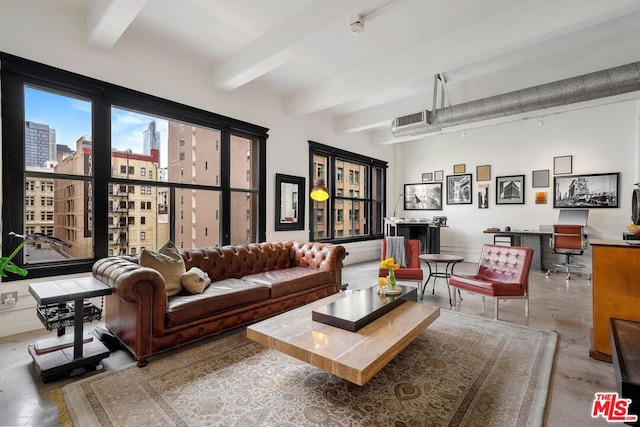 living room with concrete flooring and beamed ceiling