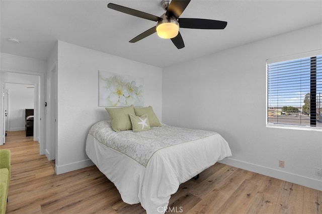 bedroom featuring hardwood / wood-style floors and ceiling fan