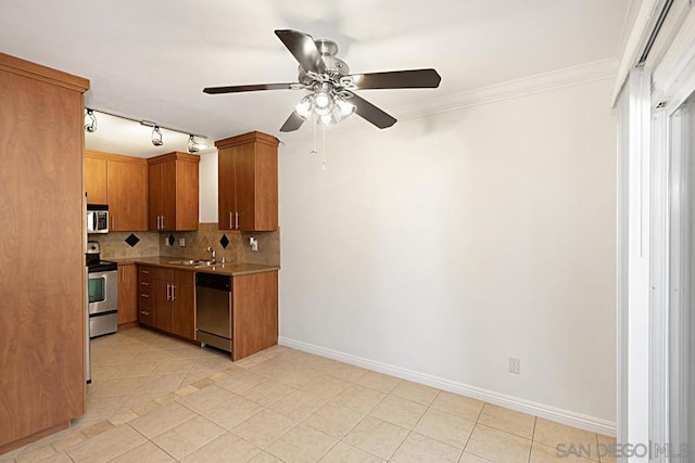 kitchen with stainless steel appliances, ornamental molding, light tile patterned floors, and decorative backsplash