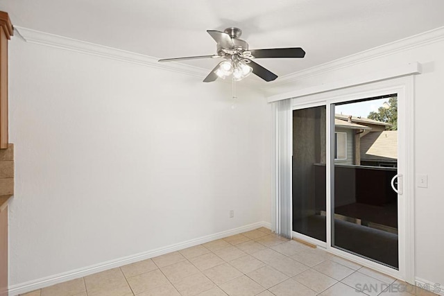 tiled spare room with ornamental molding and ceiling fan