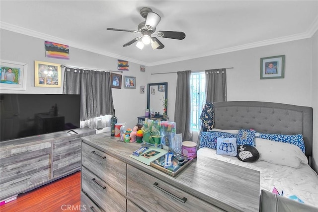 bedroom featuring ornamental molding, dark hardwood / wood-style floors, and ceiling fan