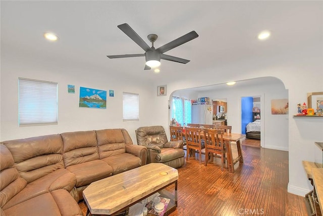 living room with hardwood / wood-style flooring and ceiling fan