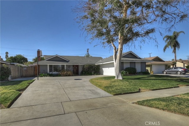 ranch-style home with a garage and a front yard