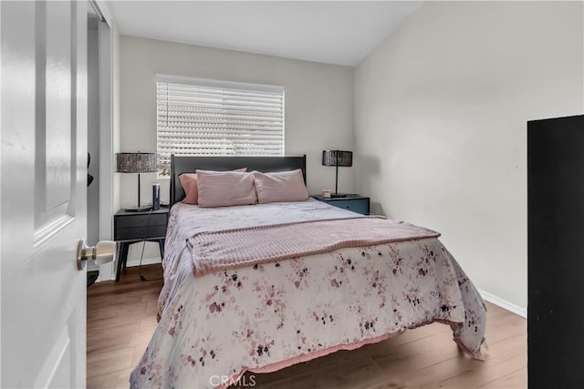 bedroom with hardwood / wood-style flooring