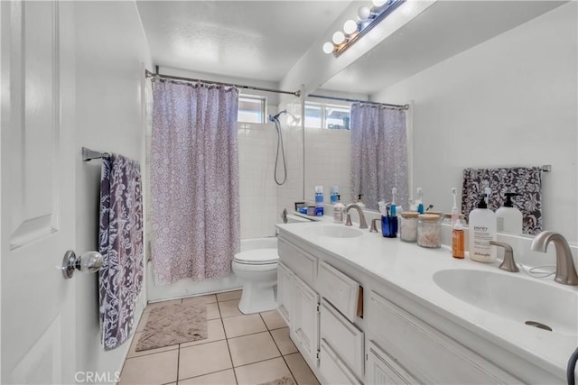 full bathroom featuring toilet, tile patterned floors, vanity, and shower / bathtub combination with curtain