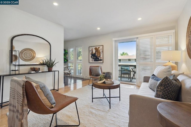 living room featuring plenty of natural light and light hardwood / wood-style floors