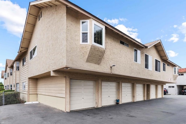 view of property exterior featuring a garage