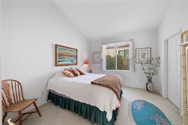 carpeted bedroom with vaulted ceiling