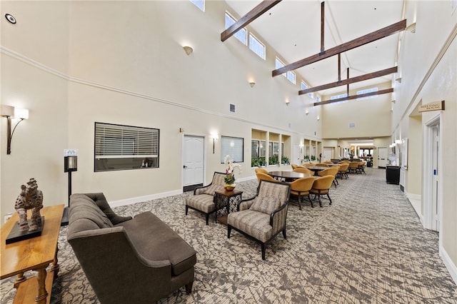 carpeted living room with a towering ceiling