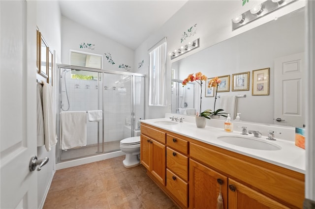 bathroom featuring walk in shower, lofted ceiling, vanity, and toilet