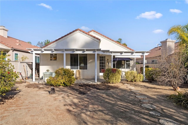 view of front of home with a pergola, a patio, and central air condition unit