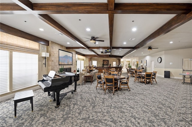 misc room with beamed ceiling, ceiling fan, coffered ceiling, and carpet