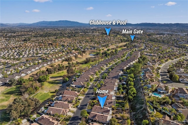 birds eye view of property with a mountain view