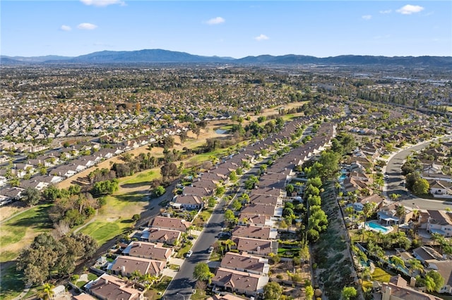 birds eye view of property with a mountain view