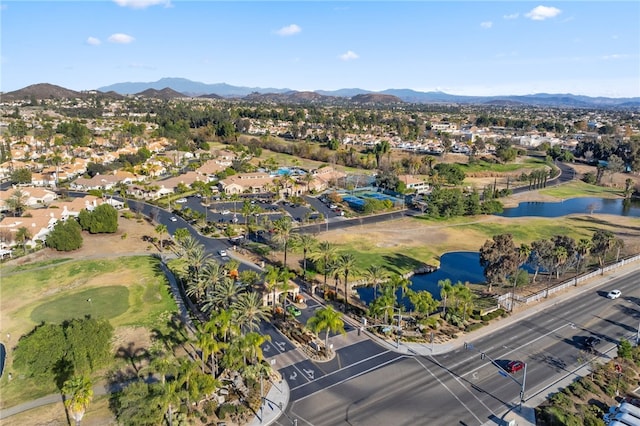 bird's eye view with a water and mountain view