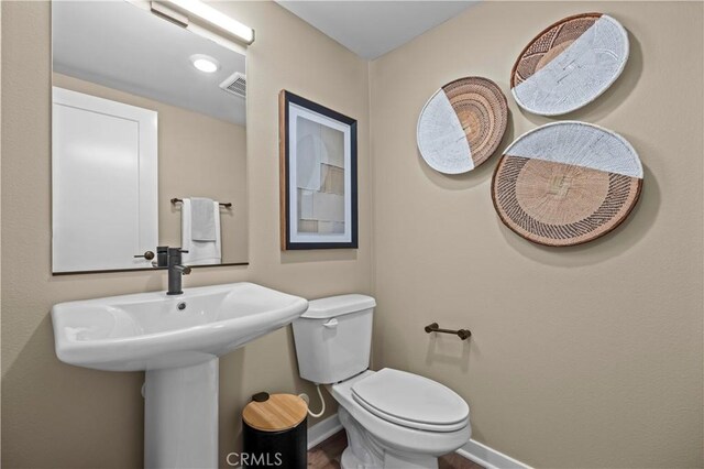 1090 Foothill Blvd, Claremont, CA 91711 - bathroom with baseboards and toilet