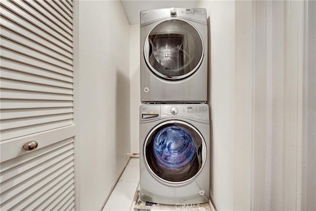 laundry room featuring laundry area and stacked washer / dryer