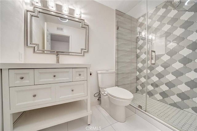 full bathroom featuring visible vents, toilet, a stall shower, vanity, and tile patterned flooring