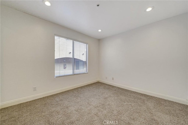 unfurnished room with carpet, baseboards, and recessed lighting