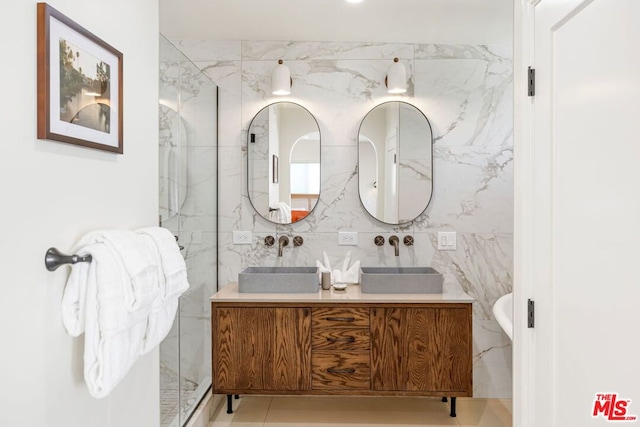 bathroom with vanity and tile walls