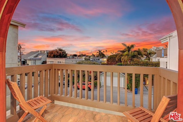 view of balcony at dusk