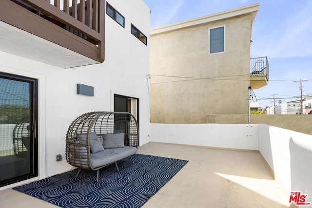 view of patio / terrace with a balcony