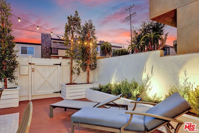 view of patio terrace at dusk