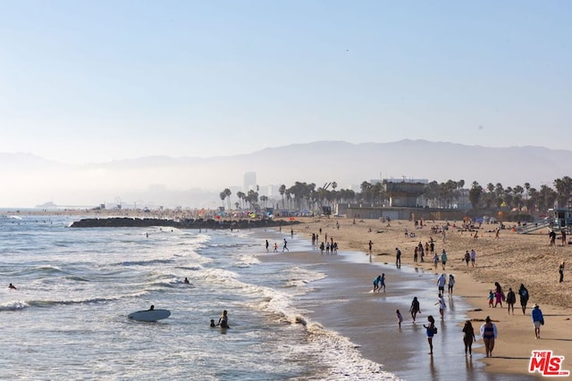 view of water feature with a view of the beach and a mountain view