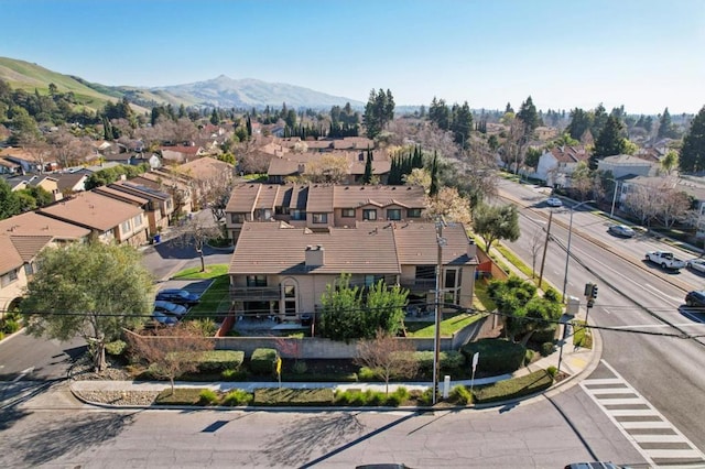 birds eye view of property featuring a mountain view