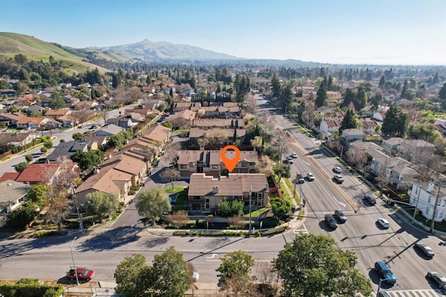 birds eye view of property with a mountain view