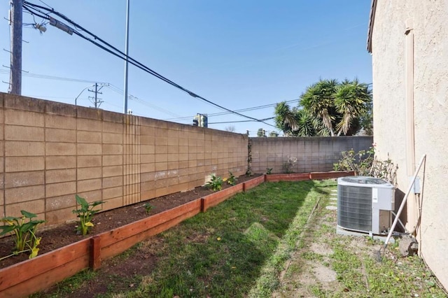 view of yard featuring central AC