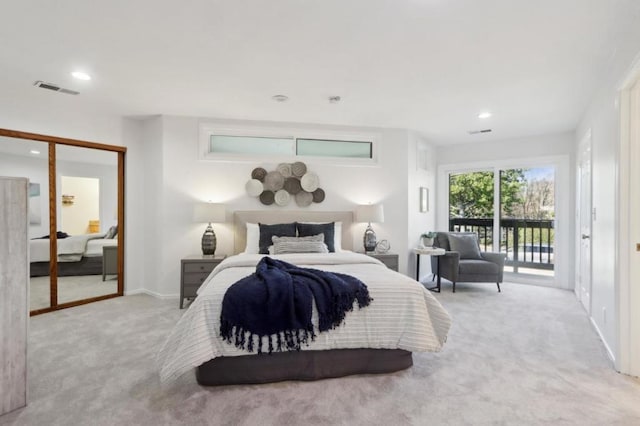 bedroom featuring light colored carpet and access to exterior