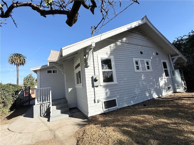 view of side of home featuring a patio