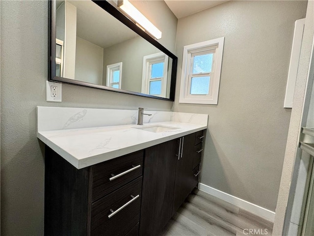 bathroom featuring vanity and hardwood / wood-style floors