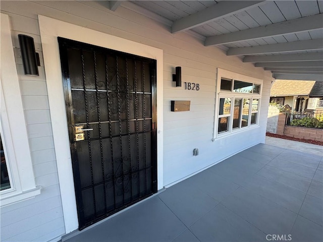 entrance to property with a porch