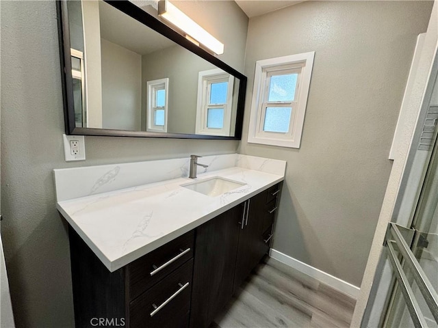 bathroom featuring vanity and hardwood / wood-style floors