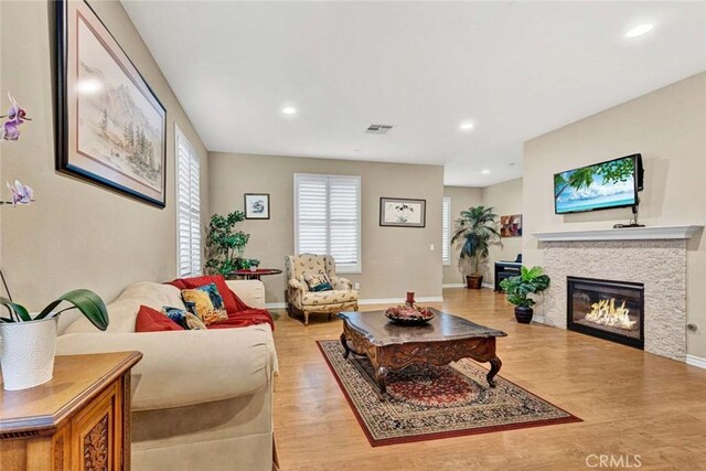 living room with light hardwood / wood-style flooring