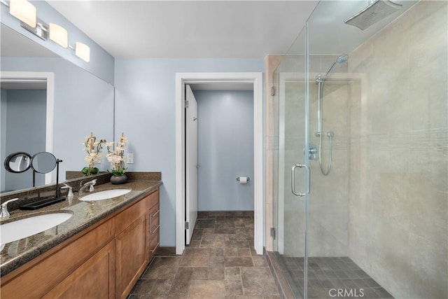 bathroom featuring vanity and a shower with door