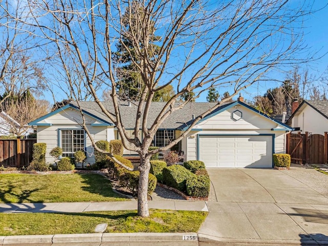 ranch-style home featuring a garage and a front yard