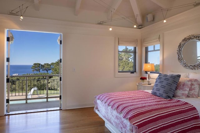 bedroom featuring hardwood / wood-style flooring, a water view, access to outside, and beam ceiling