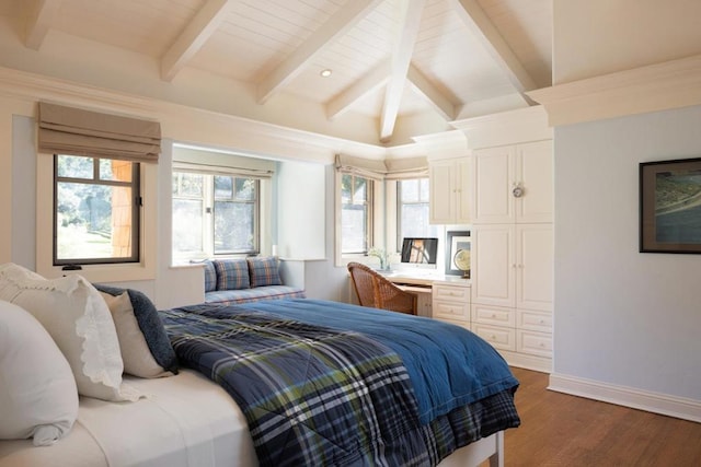 bedroom featuring dark hardwood / wood-style floors, lofted ceiling with beams, and a closet