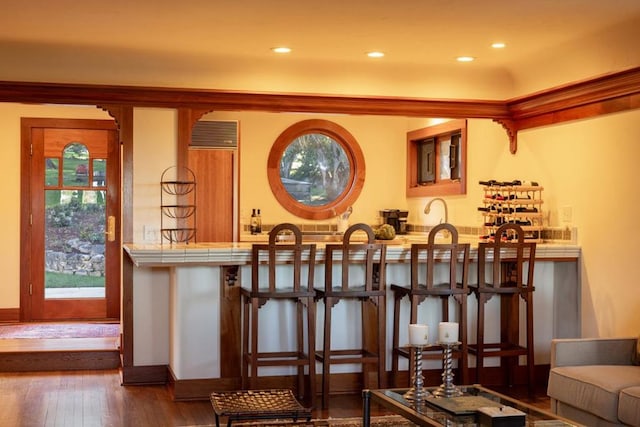 bar featuring dark wood-type flooring