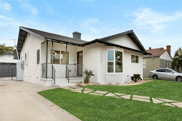 view of front of home with a garage and a front yard