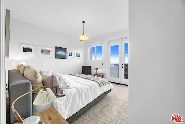 carpeted bedroom featuring access to outside and french doors