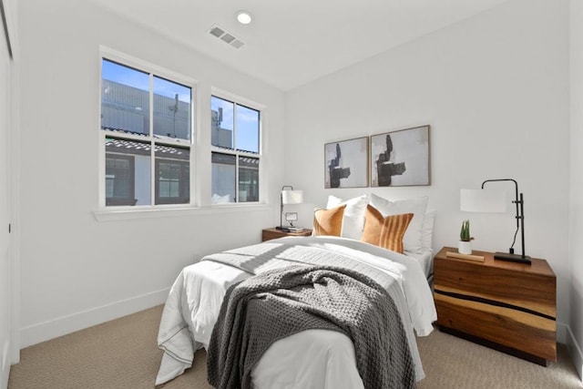 bedroom with light carpet