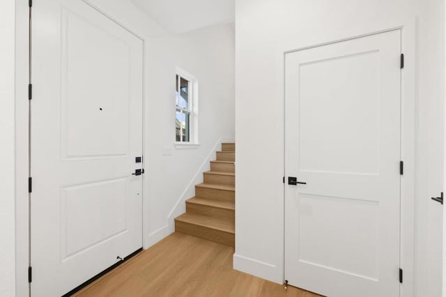 foyer entrance with light hardwood / wood-style flooring