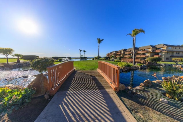 view of home's community with a water view