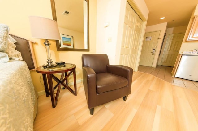 sitting room featuring hardwood / wood-style floors