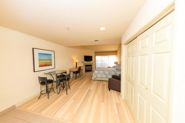 bedroom featuring a closet and light hardwood / wood-style flooring